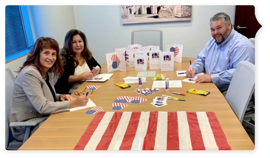 volunteers working on cards