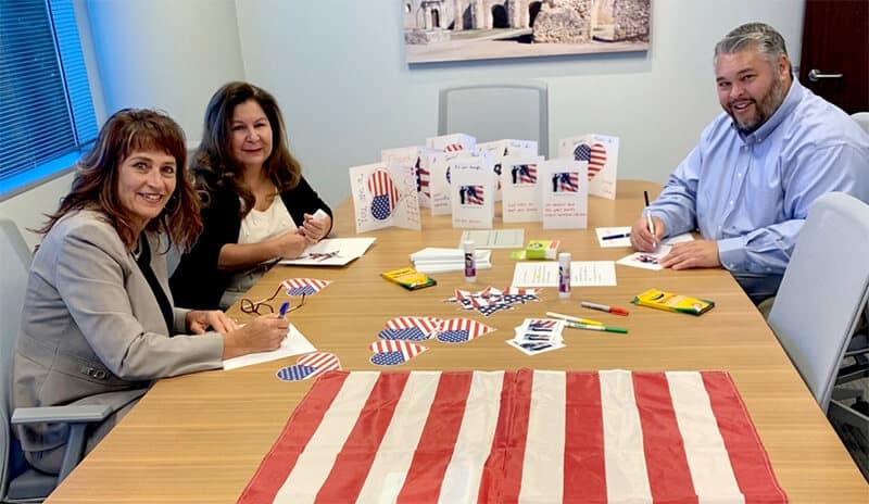 volunteers working on cards